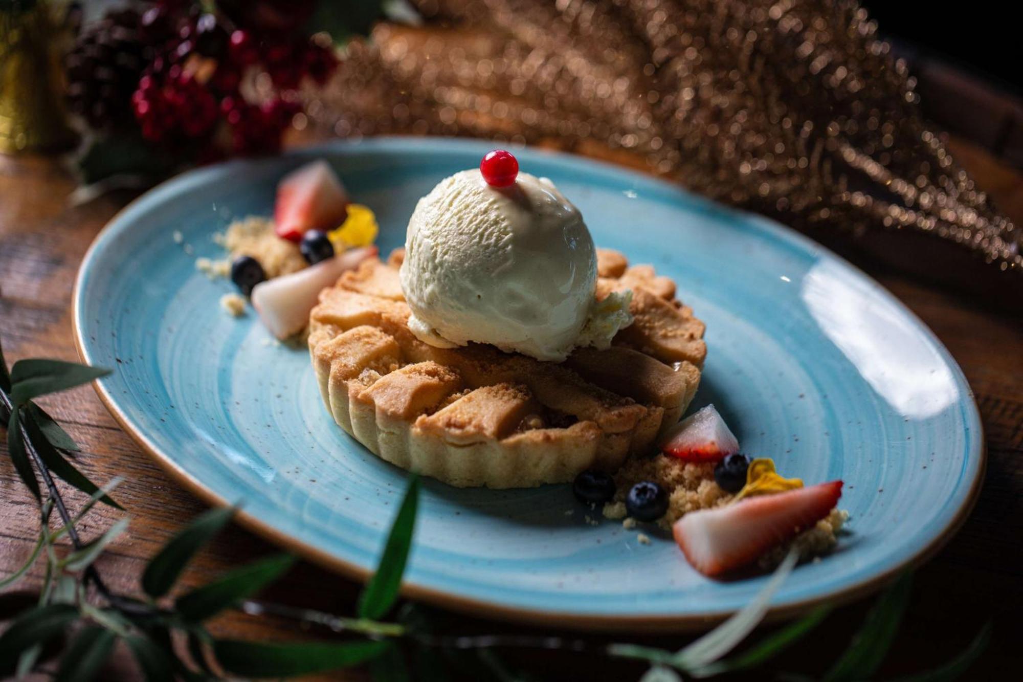 Hilton Dubai Al Habtoor City Exterior photo A fruit tart with ice cream